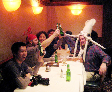 Andrew (squid hat) and I (crab hat) toasting to sea shanties with blog peeps at Science Online 09. Photo by Danica.