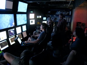 In the ROV control room.  You can see Chris there on the right with his left hand on his chin. I am in the background about dead center (the bald one with the headset on doing my cheif scientist thing.